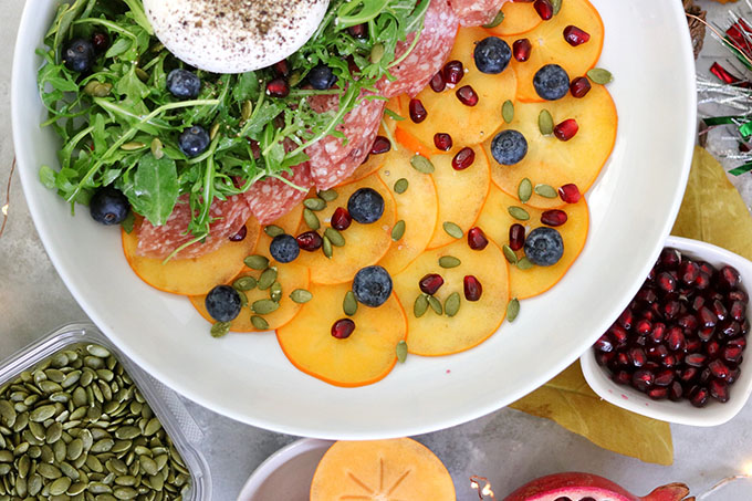 Festive Persimmon Carpaccio with Burrata and Arugula Salad - Foodology